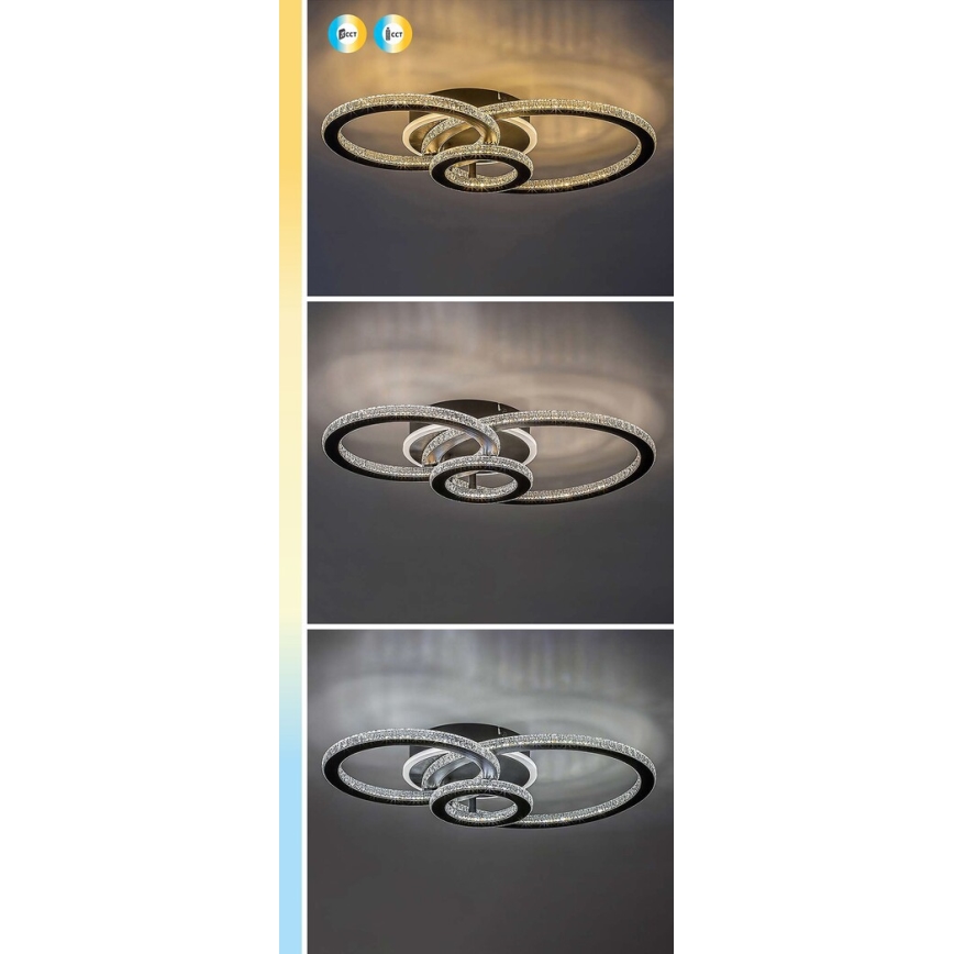 Svietidlo s tromi prepletenými kruhmi, osadenými kryštálikmi, svieti v troch farebných teplotách na strope.
