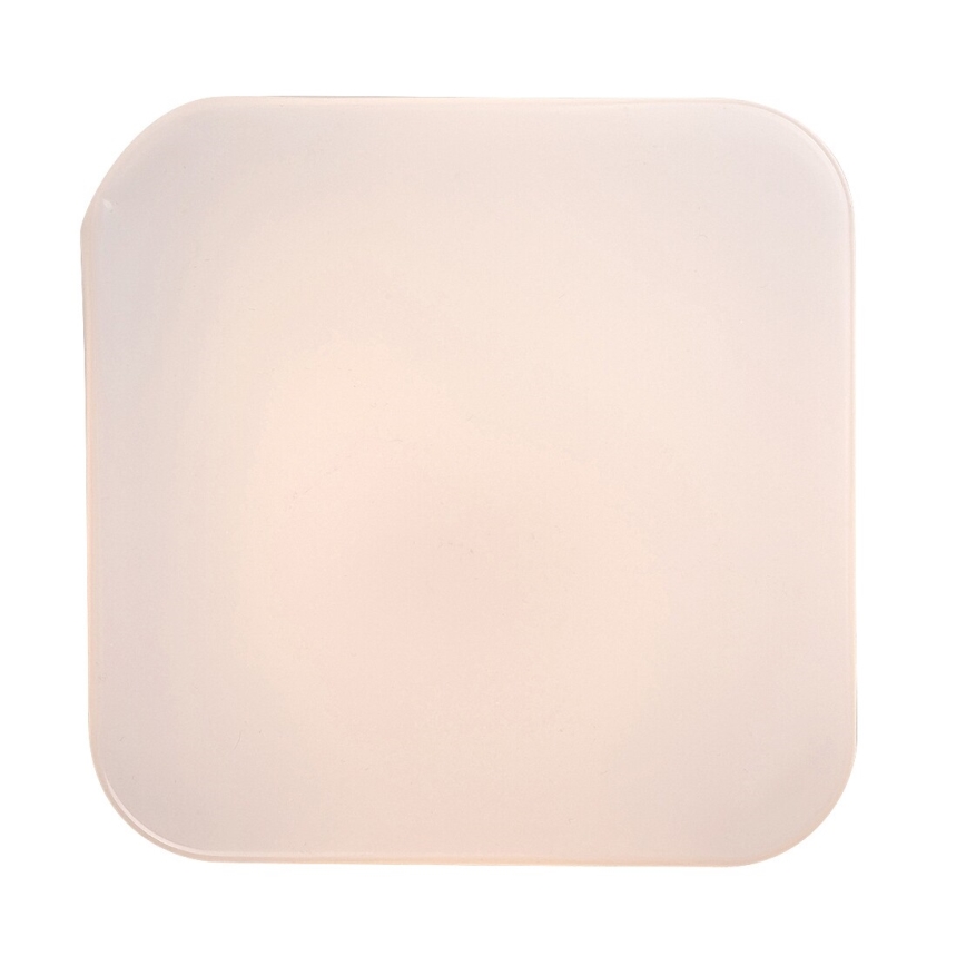 Štvorcový, mliečne biely tienidlo s mierne zaoblenými rohmi svieti. Tienidlo je osvetlené zozadu. Na obrázku nie je žiadny text.
