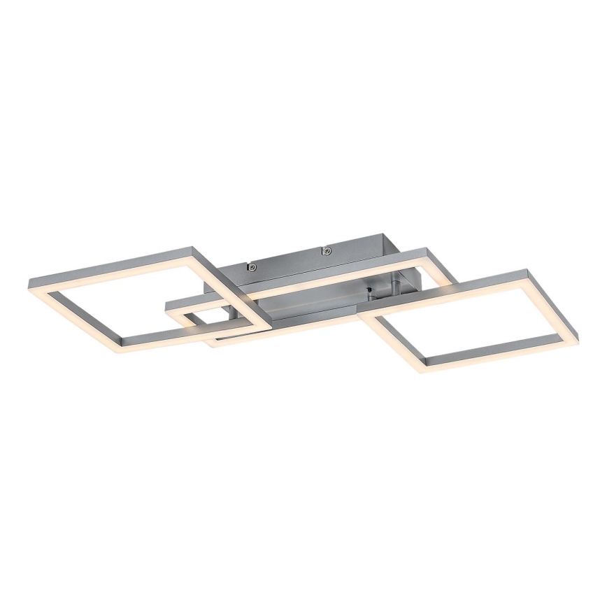 Stropné LED svietidlo s tromi prepletenými štvorcovými rámami svieti. Svietidlo je striebornej farby a je pripevnené k stropu.