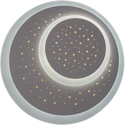 Svietidlo tvaru polmesiaca s vnútorným kruhom a zlatými hviezdičkami je osvetlené. Svietidlo je umiestnené na bielom pozadí.