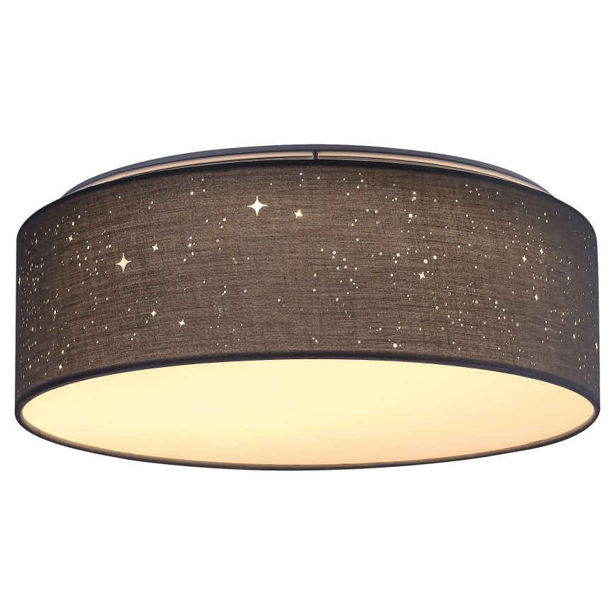 Svietidlo svieti. Telo svietidla je tmavosivé, valcovité, látkové, s vyobrazenými hviezdami. Svetlo je teplé, biele.