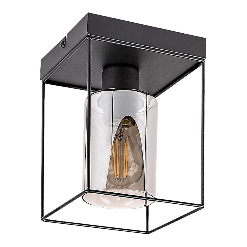 Svietidlo svieti. Je umiestnené v štvorcovej kovovej konštrukcii s valcovým skleneným tienidlom a žiarovkou v tvare Edisonovej žiarovky. Celok je v čiernej a sivej farbe.