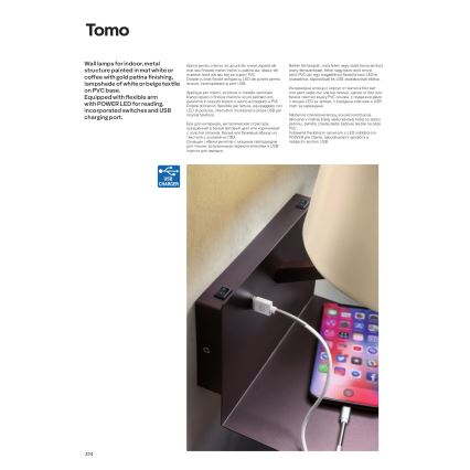 Nástenná lampa s nabíjacím USB portom. Lampa je pripevnená na stenu a je k nej pripojený mobilný telefón nabíjajúci sa cez USB kábel. Lampa má pružné rameno a je vyrobená z kovu a plastu.