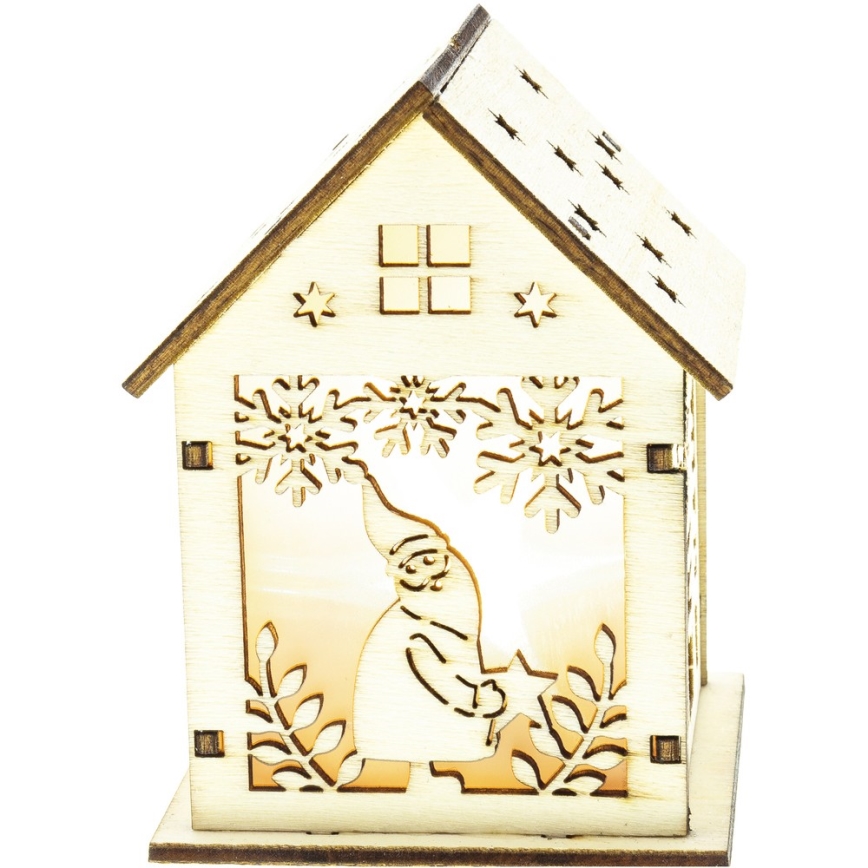 Drevený domček s vyrezávaným Snehuliakom v okne, ktorý je osvetlený zo zadu. Na dome sú snehové vločky a hviezdy. Domček stojí na podstavci.