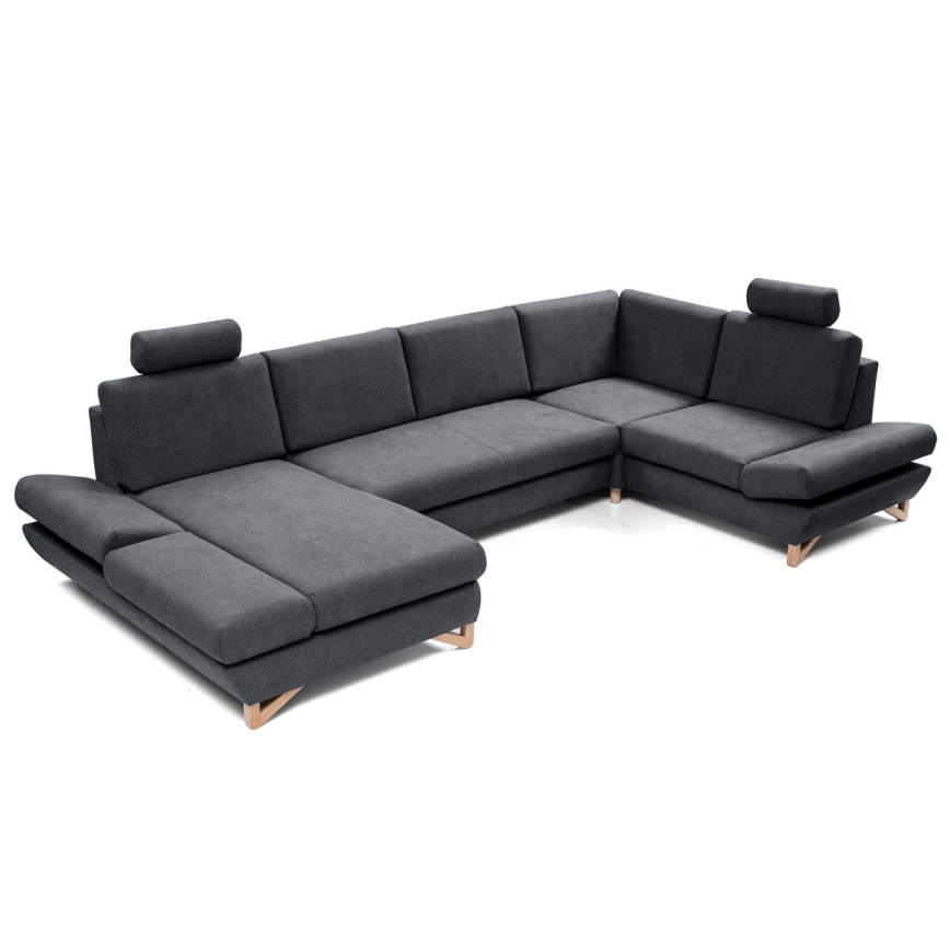 Rohová sedačka s opierkami hlavy je umiestnená na bielom pozadí. Sedačka je tmavosivá, s drevenými nožičkami.