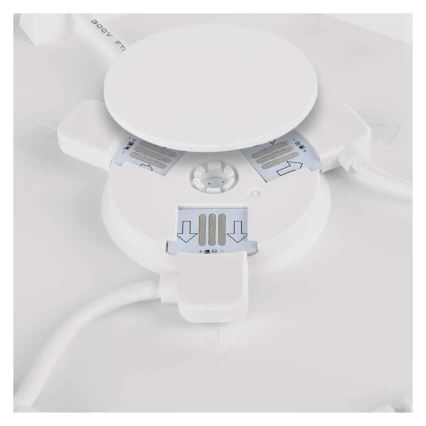 Biely kruhový panel sa otvára, odhaľujúc vnútorné LED diódy a konektory. Panel je pripojený k elektrickému káblu. Na panely sú šípky a text „+極和-極“.