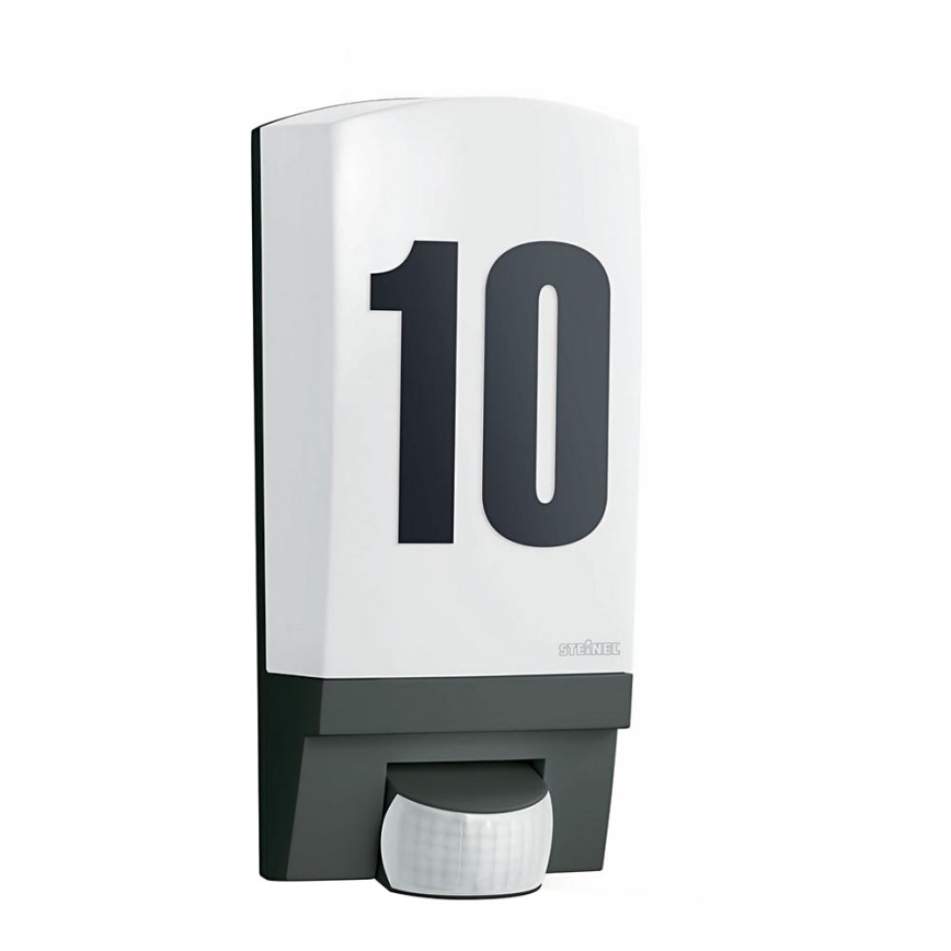 Biely senzor pohybu s veľkým číslom "10" umiestneným na prednej strane. Vyrobený firmou "STEINEL", nachádza sa na jednoduchom bielom pozadí.
