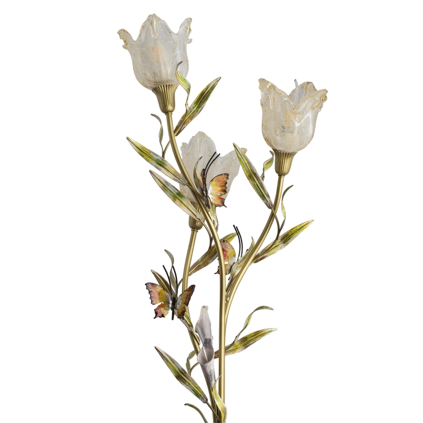 Stojacia lampa s tvarom rastliny má tri tulipánové tienidlá zo svetlého skla. Zlatá kovová konštrukcia je zdobená listami a motýľmi.