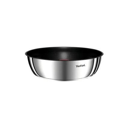 Nerezová panvica Tefal s nepriľnavým čiernym dnom stojí na bielom pozadí. Na bočnej strane je vyrazené logo Tefal.
