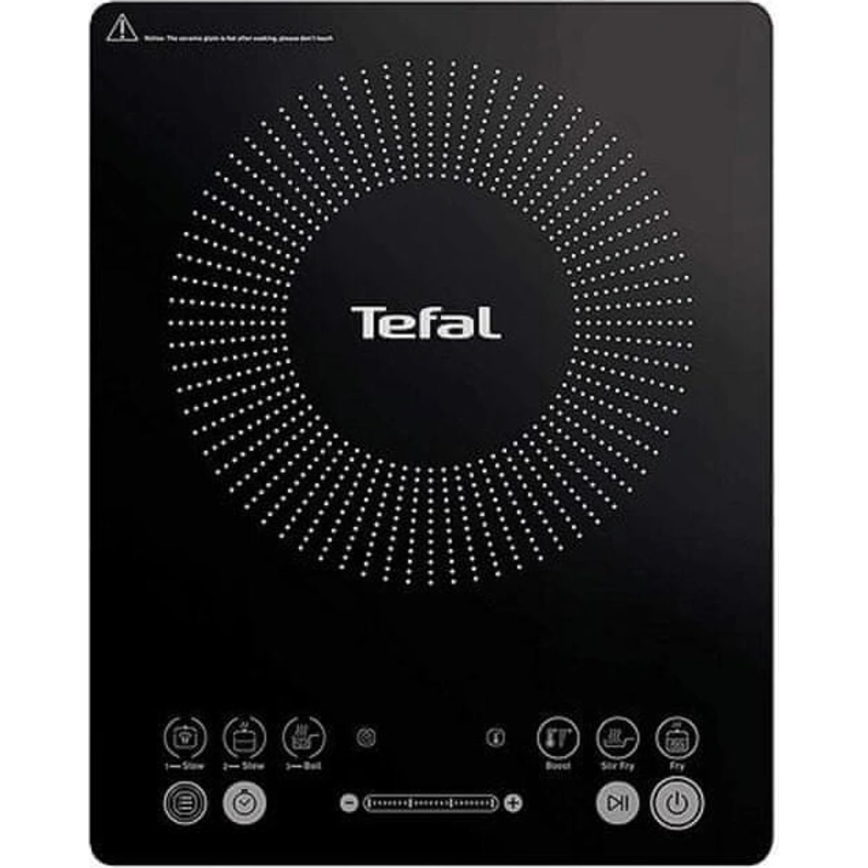 Indukčná varná doska Tefal s dotykovým ovládaním a niekoľkými prednastavenými režimami varenia (napr. pomalé varenie, smaženie, varenie v pare). Na vrchu má kruhový dizajn s bodkami. Upozornenie: „Before the ceramic plate is hot after cooking, please don't touch.“