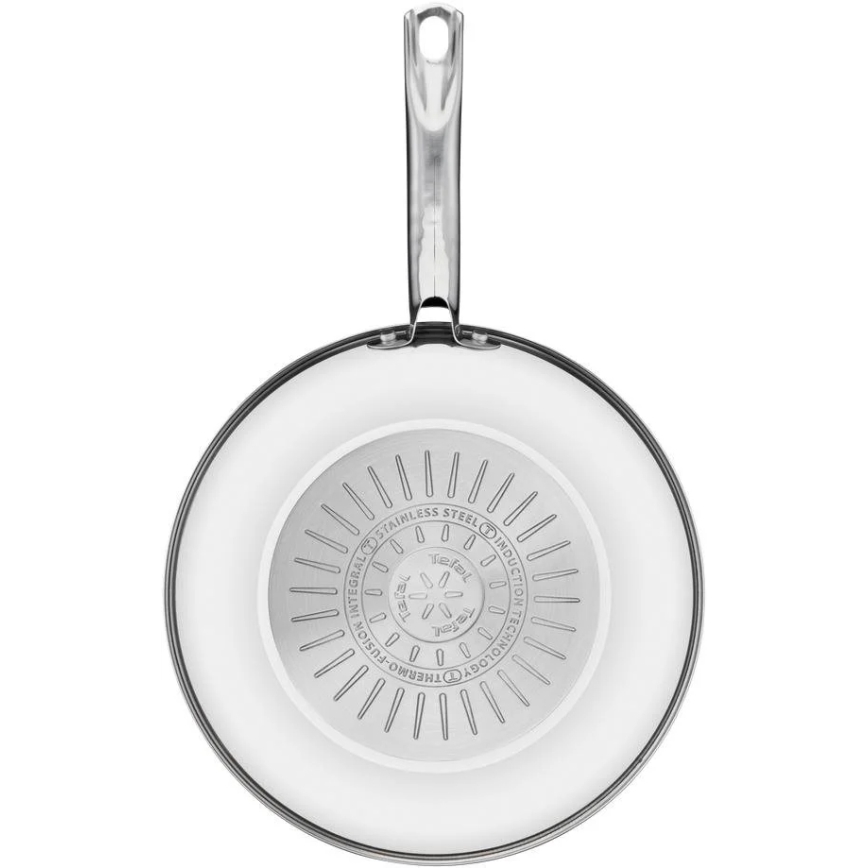 Panvica s kovovou rúčkou je zobrazená zhora. Na dne panvice je vyrytý nápis: „INTEGRAL STAINLESS STEEL INDUCTION TECHNOLOGY THERMO-FUSION“. V strede kruhu je logo značky Tefal.