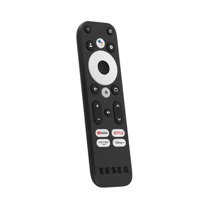 Diaľkové ovládanie Tesla ovláda televízor. Má tlačidlá pre hlasitosť, prepínanie kanálov, domovskú obrazovku a prístup k Netflixu, YouTube, Prime Video a Disney+. Na spodku je nápis TESLA.