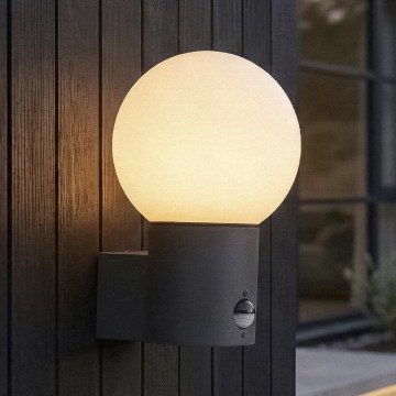 Vonkajšia nástenná lampa so senzorom pohybu a súmraku STONO 1xE27/15W/230V IP65 antracit