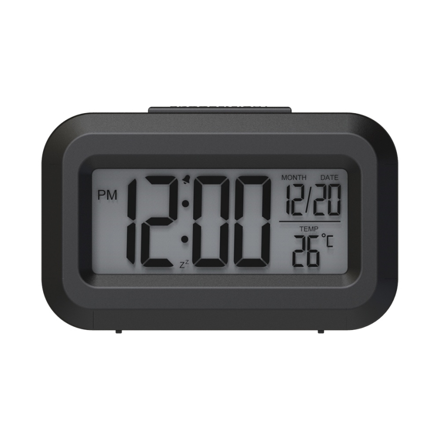 Digitálne hodiny zobrazujú čas 12:00 PM, dátum 12/20 a teplotu 26 °C. Sú čierne a obdĺžnikového tvaru.