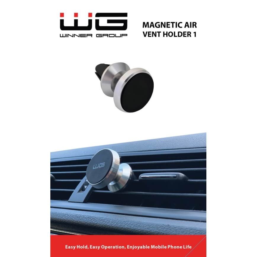 Magnetický držiak telefónu sa pripevňuje do ventilačnej mriežky auta. Držiak je strieborno-čierny, značka WG (Winner Group), model Magnetic Air Vent Holder 1. Uľahčuje držanie, obsluhu a používanie mobilného telefónu.