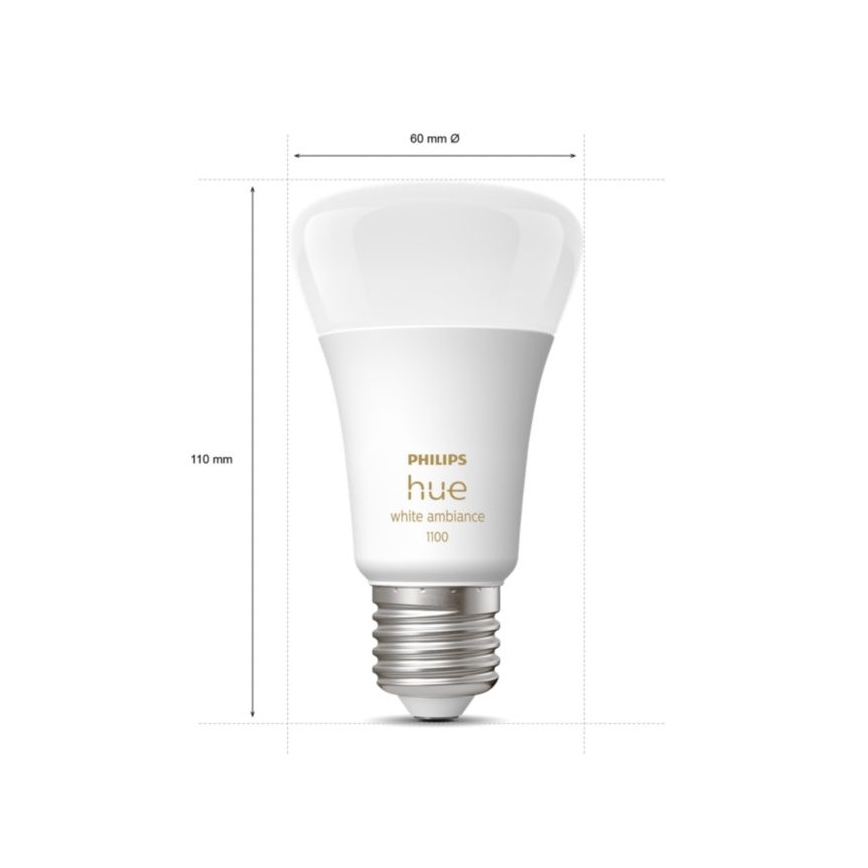 Žiarovka Philips Hue white ambiance 1100 s rozmermi 60 mm v priemere a 110 mm na výšku, je zobrazená na bielom pozadí.