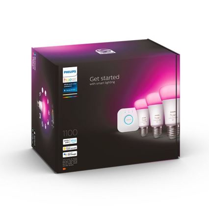 Balenie Philips Hue obsahuje tri inteligentné žiarovky a rozbočovač. Na obale je text: „Get started with smart lighting“, „1100“, a logá kompatibility s Apple, Google a Amazon Alexa.