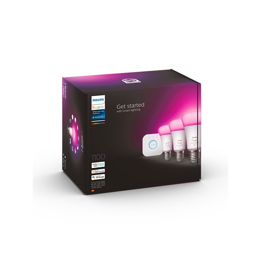 Balenie Philips Hue obsahuje tri inteligentné žiarovky a rozbočovač. Na obale je text: „Get started with smart lighting“, „1100“, a logá kompatibility s Apple, Google a Amazon Alexa.