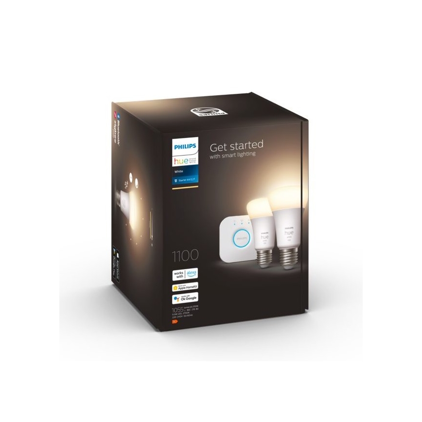 Balenie inteligentného osvetlenia Philips Hue obsahuje dve LED žiarovky a ovládač. Balenie je tmavé, s bielym logom a textom Get started with smart lighting, works with Alexa, Apple HomeKit, OK Google. Čísla 1100 a 1055 sú tiež uvedené.